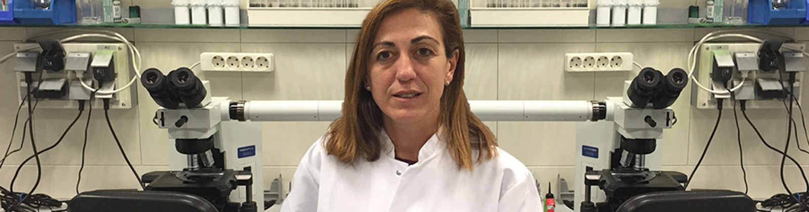 Laura, malaria research scientist in a lab